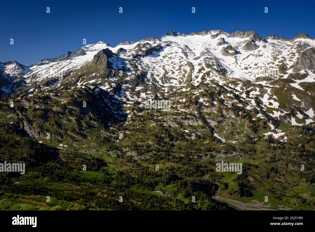 ENG: Maladeta Massif and the Aneto summit, the hightest peak in the Pyrenees, in a summer sunrise, seen from the path to the port of Benasque. (Benasq Stock Photo
