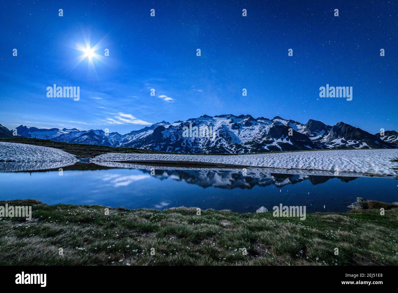 Maladeta range and the Aneto peak at night with the Moon. Viewed from the other side of the valley, near to Port de Benasque (mountain pass, Benasque) Stock Photo