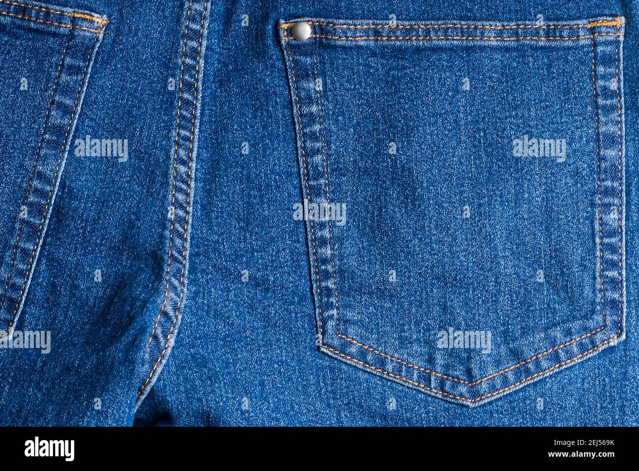 jeans pockets. blue jeans macro texture background. Stock Photo