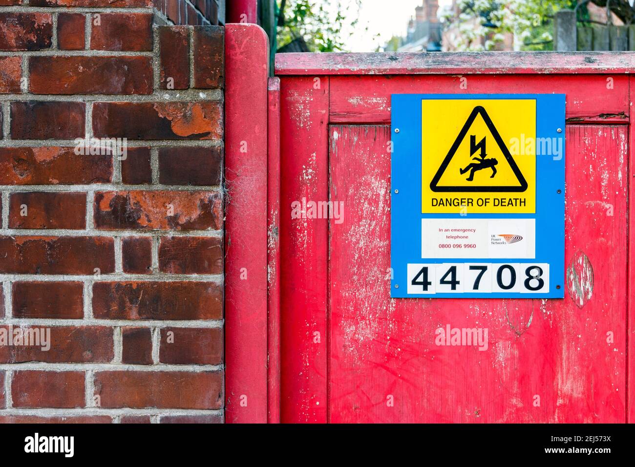 A graphic sign reading 'Danger Of Death' on the gate of an electricity substation in London, UK Stock Photo