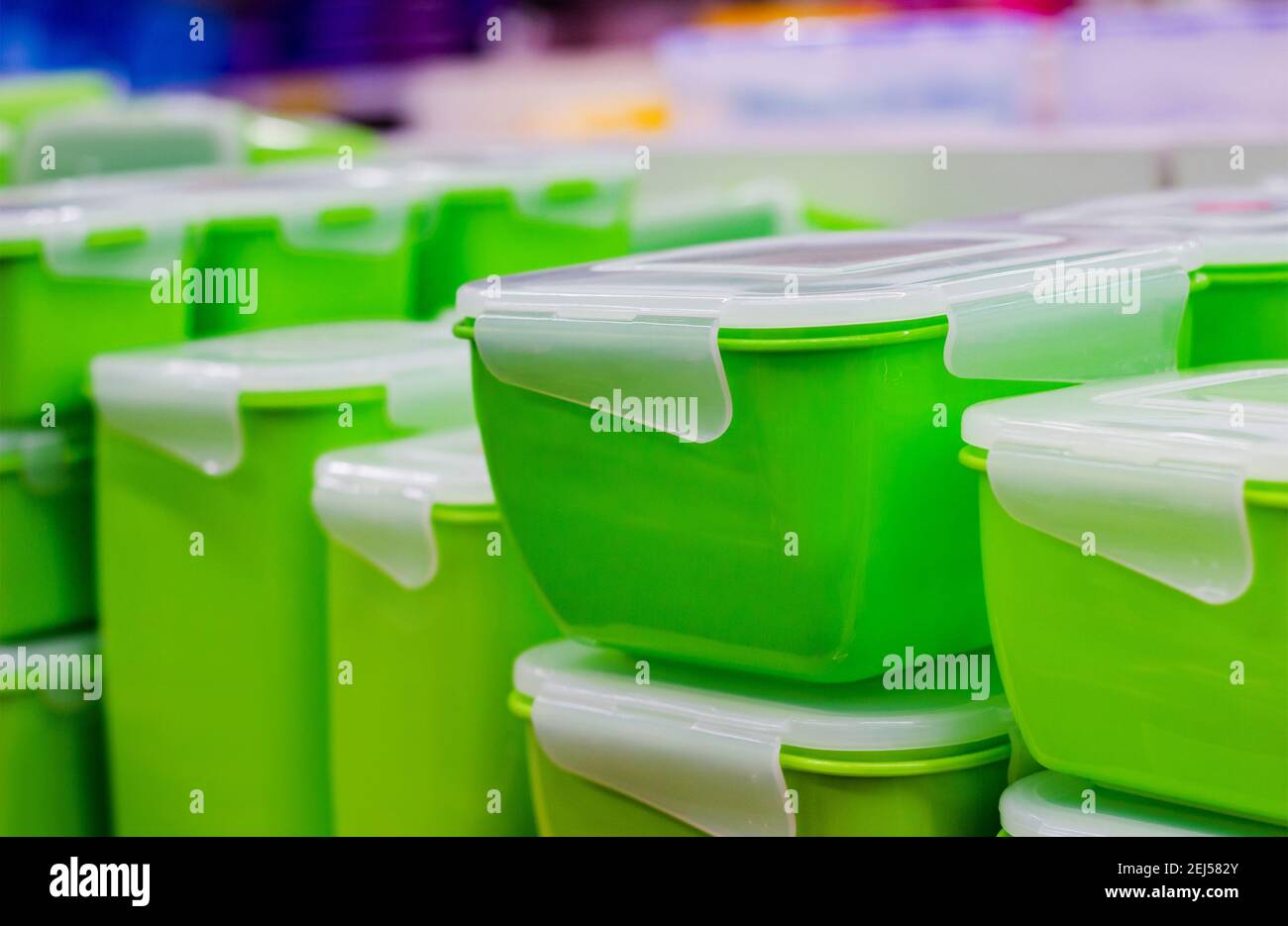 Photo of green plastic containers standing in store Stock Photo Alamy