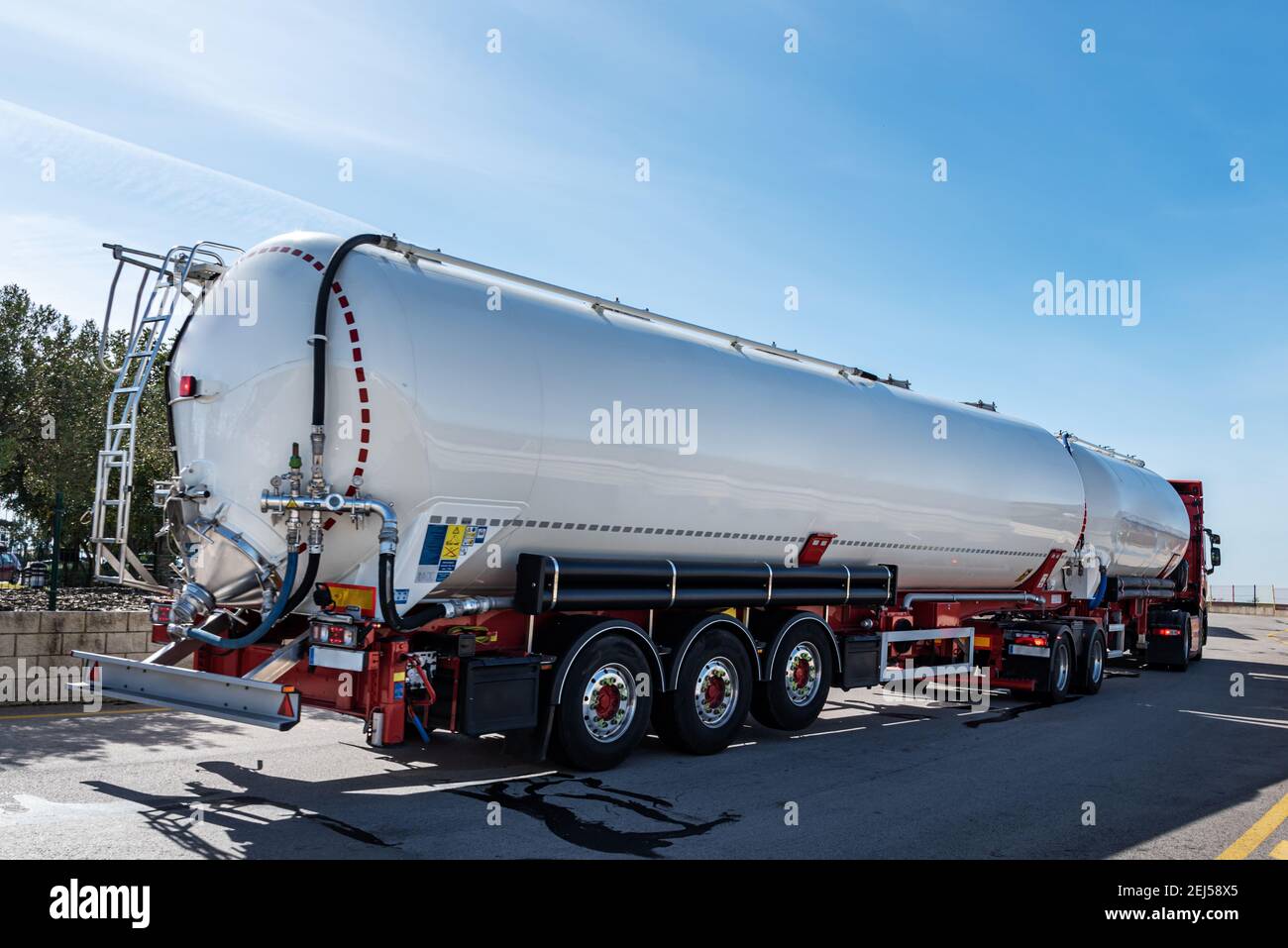 Euro modular system or European road train, truck with two trailers for transporting powders and bulk. Stock Photo