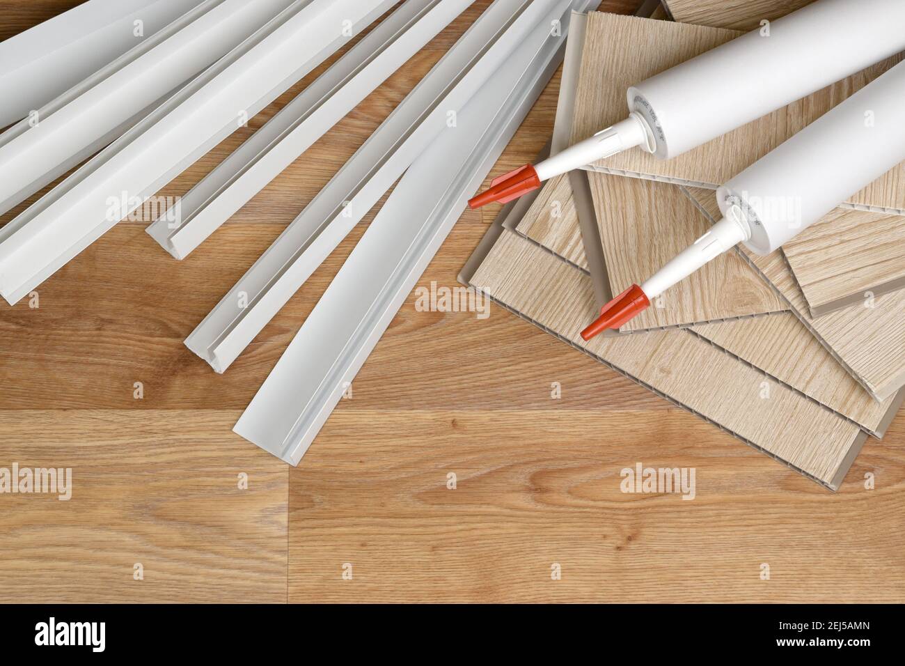 Set of items for PVC ceiling indoor works. Assembly adhesive bottles and PVC  panels with plastic corners. Indoor VPC siding kit. Interior renovation w  Stock Photo - Alamy