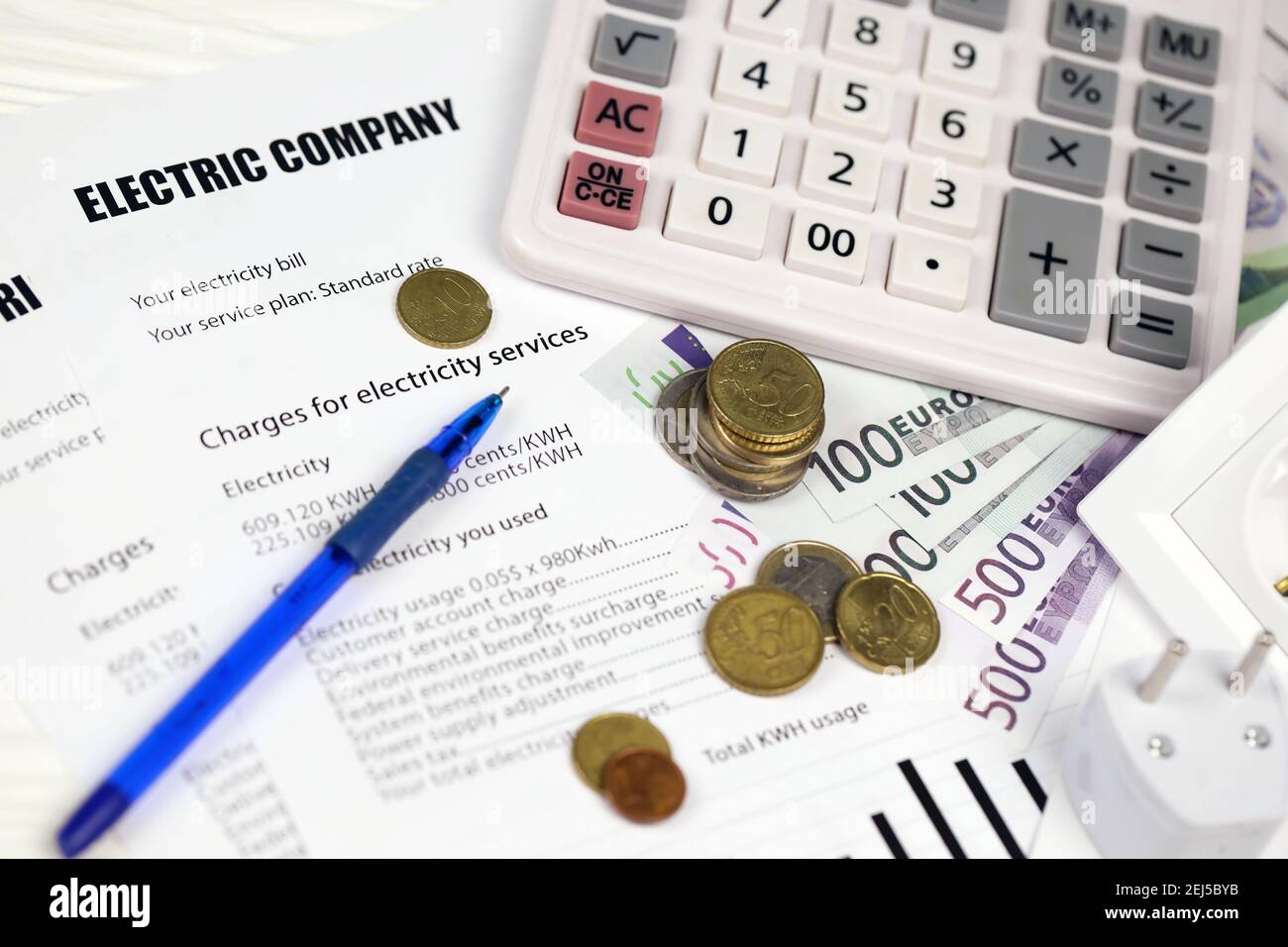 Calculator and Euro bills with pen on european electricity bill. Concept of  saving money by using energy savings led light bulbs and electric bill pay  Stock Photo - Alamy