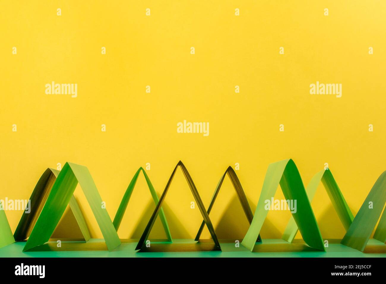 Abstract colour paper background. Green and yellow geometric shape
