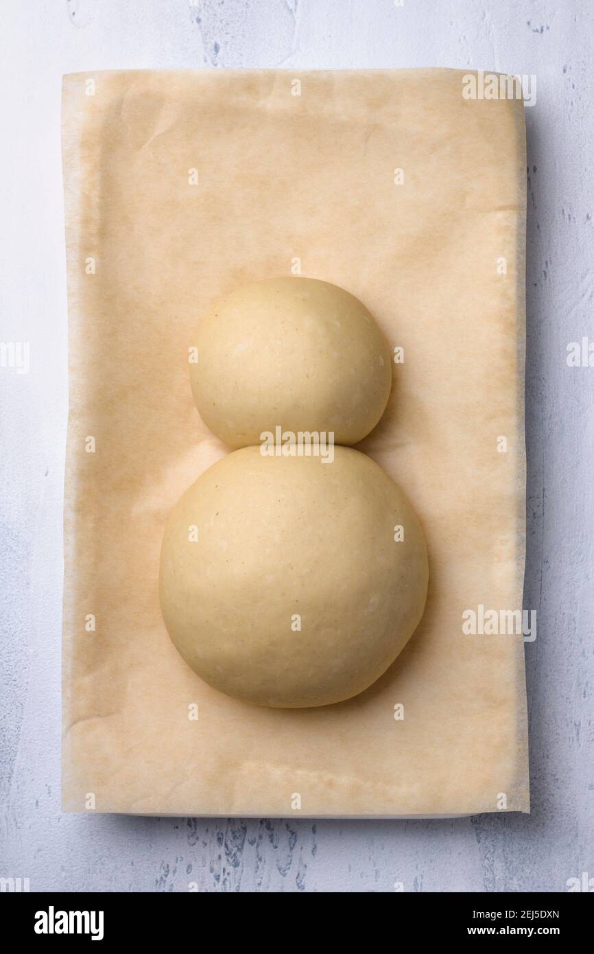 A process of making Easter Bunny Buns of delicious sweet dough. Do it yourself. Step by step instruction. Step 1. Make two balls of dough - a body and Stock Photo
