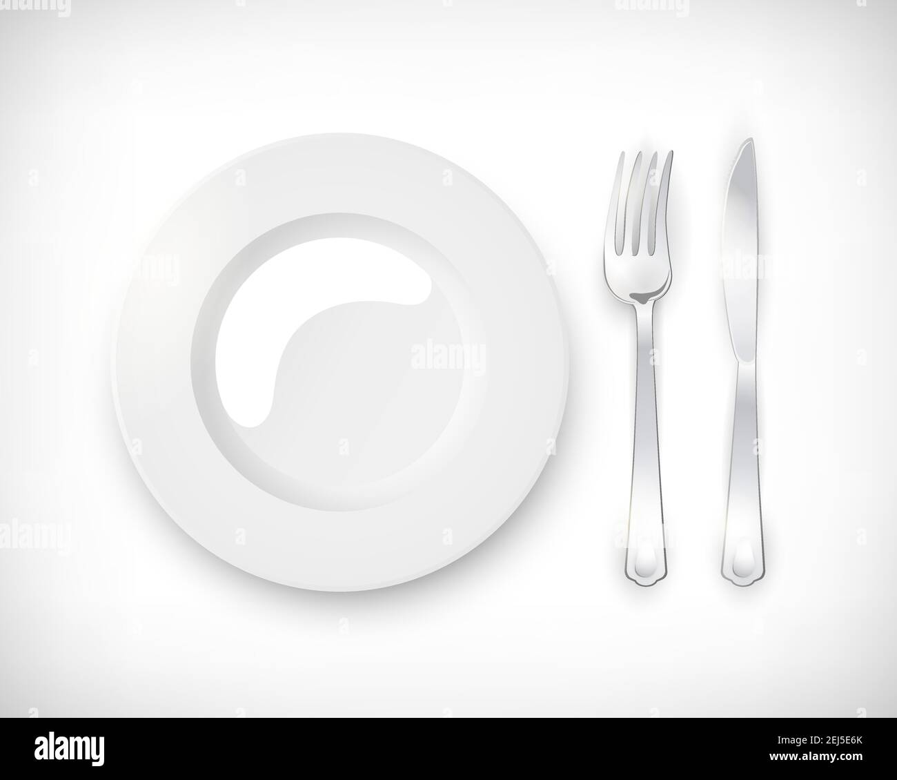 Top view white empty round plate with cutlery set of silver fork and ...