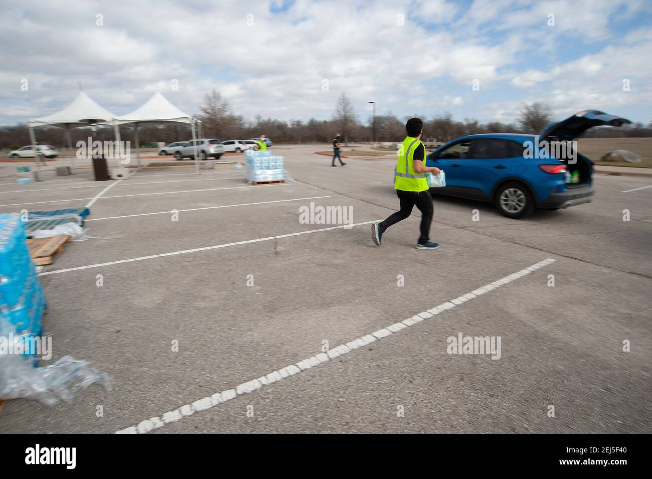 February 21, 2021 Vehicles wait in line at the Onion Creek Soccer