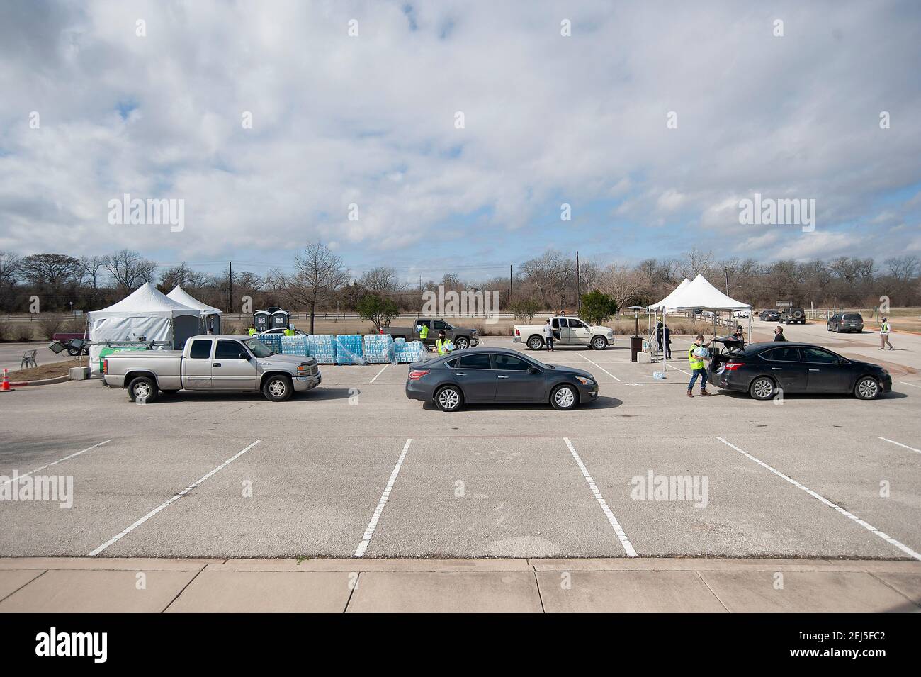 February 21, 2021 Vehicles wait in line at the Onion Creek Soccer