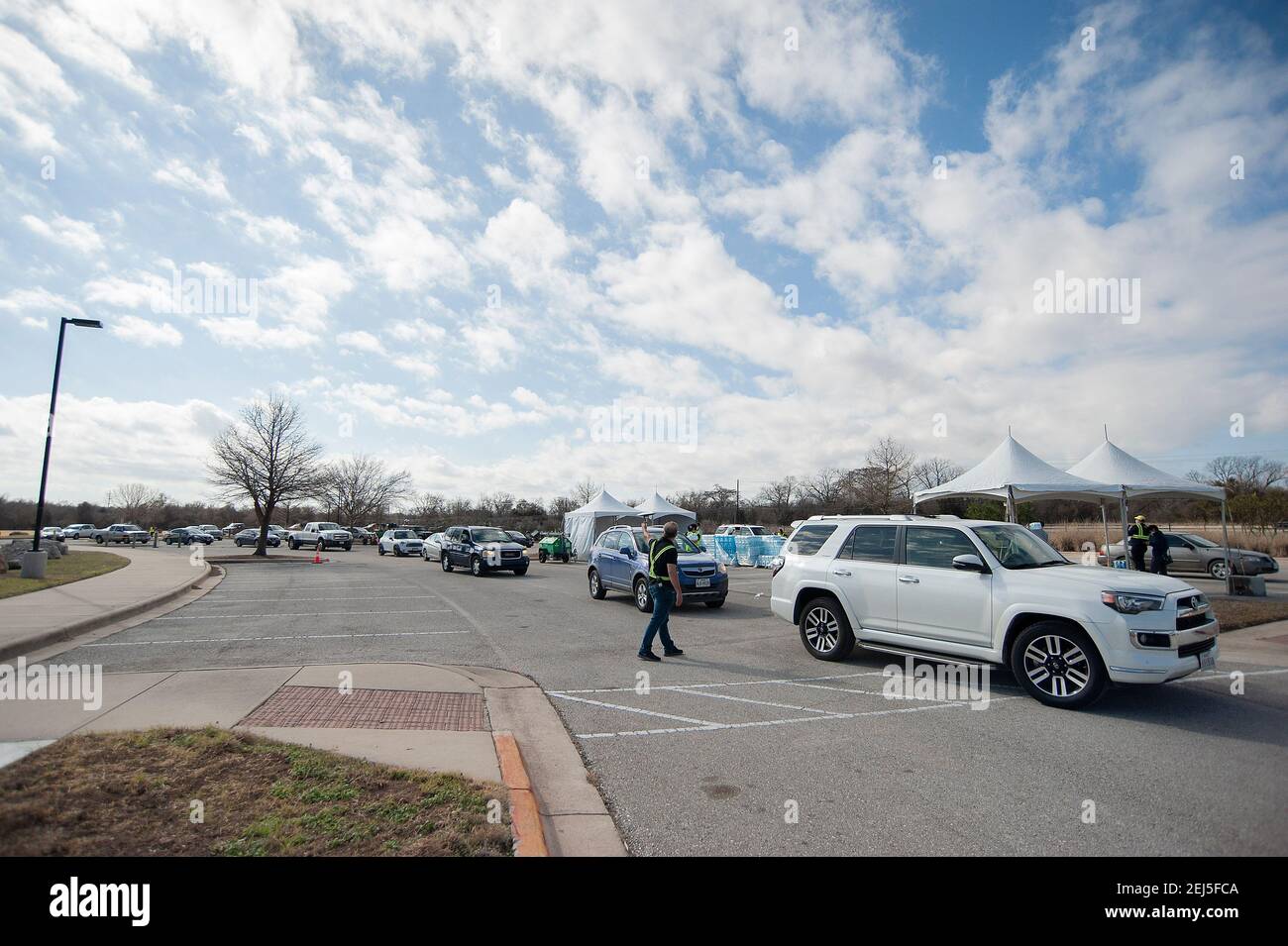 February 21, 2021 Vehicles wait in line at the Onion Creek Soccer