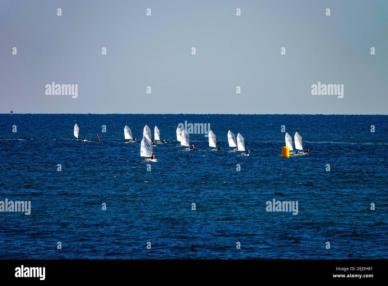 Twelve small sailing dingies off La Mata, Torrevieja, Costa Blanca, Spain Stock Photo