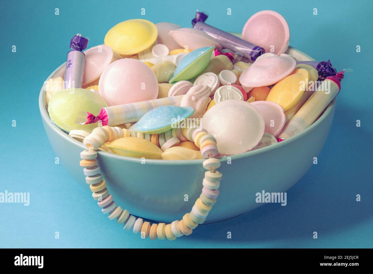 Blue bowl filled with classic British sweets and candy Stock Photo