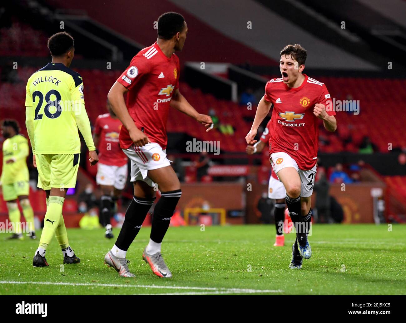 Manchester United's Daniel James (right) celebrates scoring their side's second goal of the game during the Premier League match at Old Trafford, Manchester. Picture date: Sunday February 21, 2021. Stock Photo