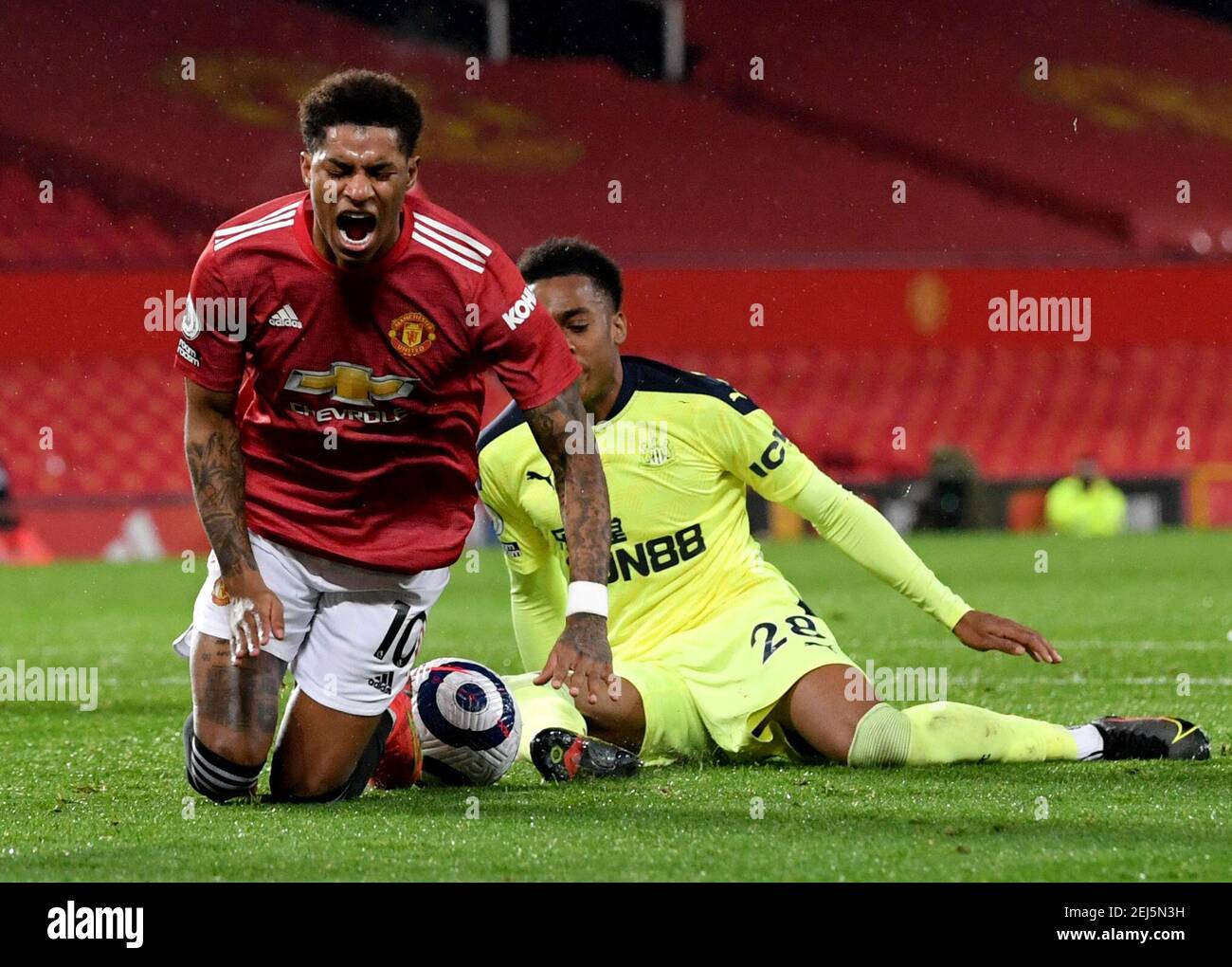 Newcastle United's Joe Willock (right) fouls Manchester United's Marcus Rashford resulting in a penalty during the Premier League match at Old Trafford, Manchester. Picture date: Sunday February 21, 2021. Stock Photo