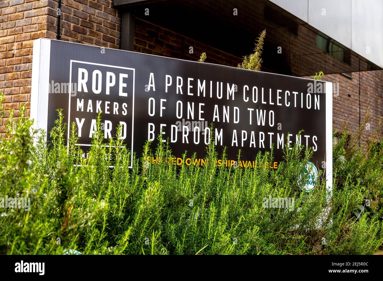 Sign in front of new, residential block Ropemakers Yard with properies available under the Shared Ownership scheme in Limehouse, London, UK Stock Photo