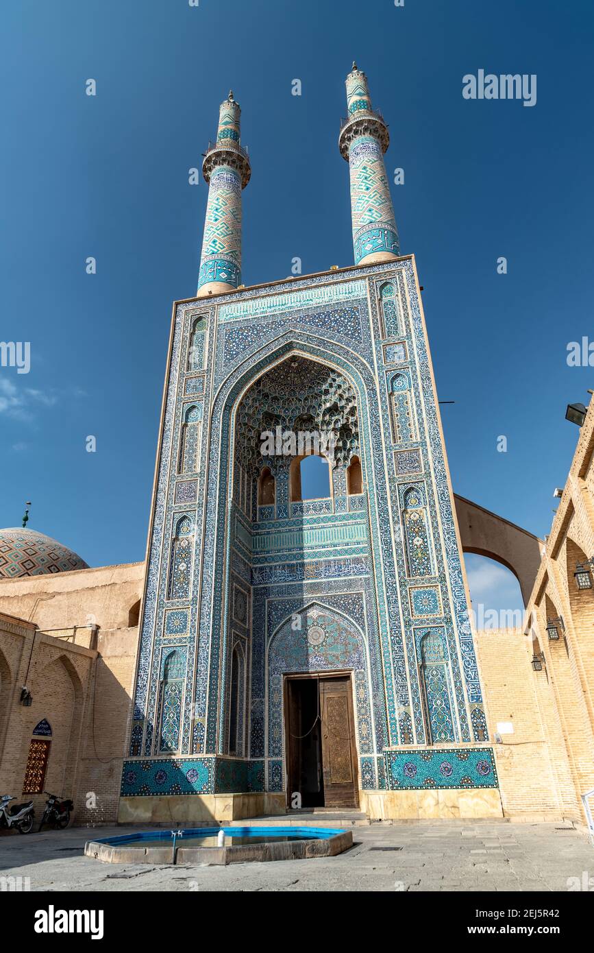 IRAN, YAZD - DECEMBER 22, 2018. The grand iwan of Jameh mosque in Yazd. Portal and minarets. Iran. Stock Photo
