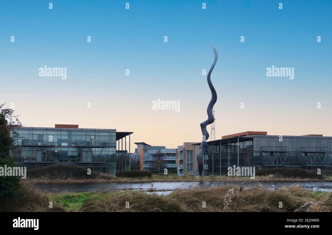 Angela Conner’s sculpture, WAVE, in the Parkwest Business park in Dublin, Ireland. It is inspired by Islamic calligraphy and blowing saplings. Stock Photo