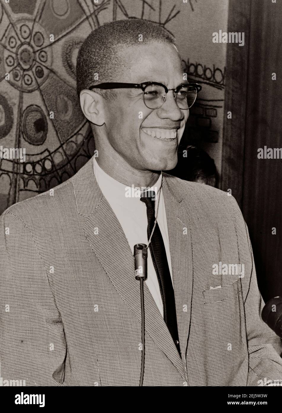 Malcolm X during an interview, half-length portrait, facing right. Photo by Ed Ford Stock Photo