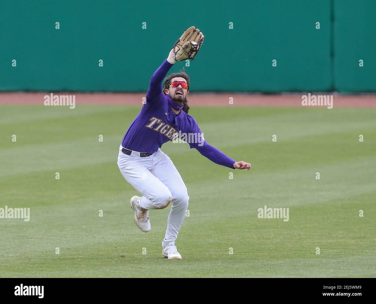 Baton Rouge, LA, USA. 21st Feb, 2021. LSU's center fielder Giovanni DiGiacomo (7) makes a diving catch during NCAA Baseball action between the Air Force Academy and the LSU Tigers at Alex Box Stadium, Skip Bertman Field in Baton Rouge, LA. Jonathan Mailhes/CSM/Alamy Live News Stock Photo