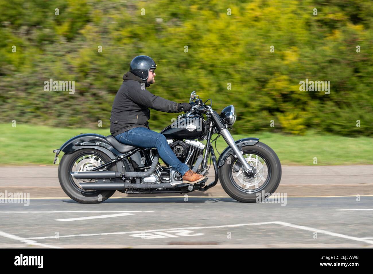 Harley Davidson 103 Cubic Inches motorcycle being ridden in Southend on Sea, Essex, UK, on a bright sunny winter day, during COVID 19 lockdown Stock Photo