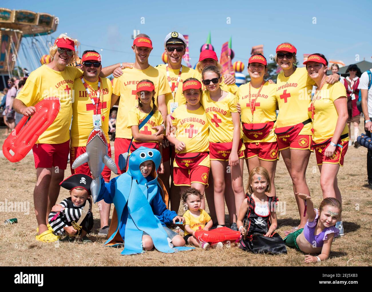 Festival goers in Baywatch fancy dress at Camp Bestival 2018, Lulworth