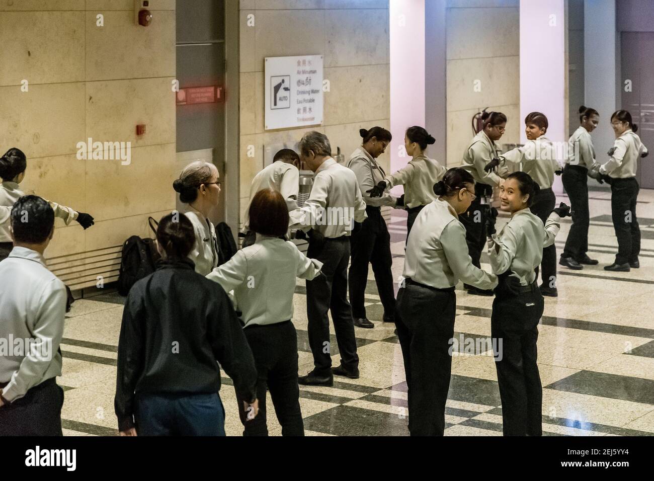 Airport security staff is rehearsing body search procedures Stock Photo