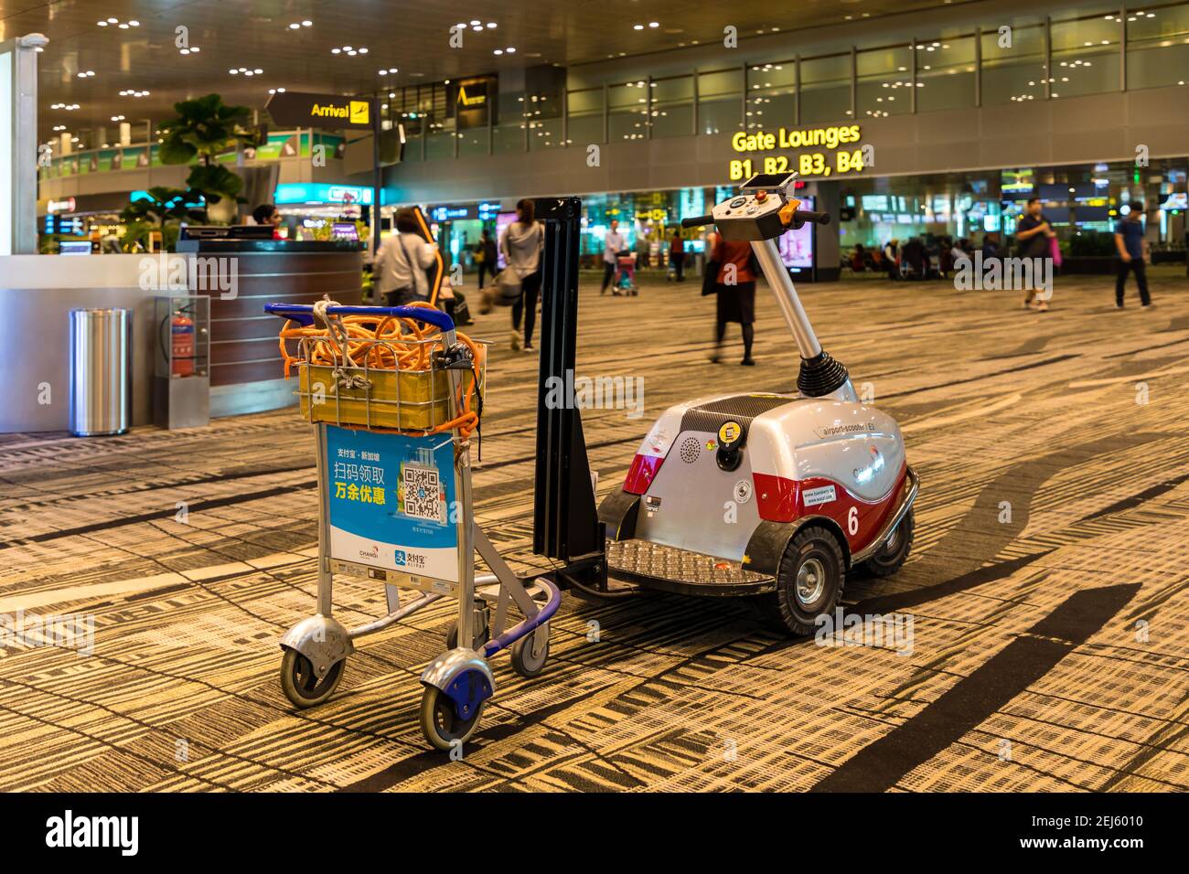 Airport Scooter for luggage trolley collecting at Changi International Airport Stock Photo