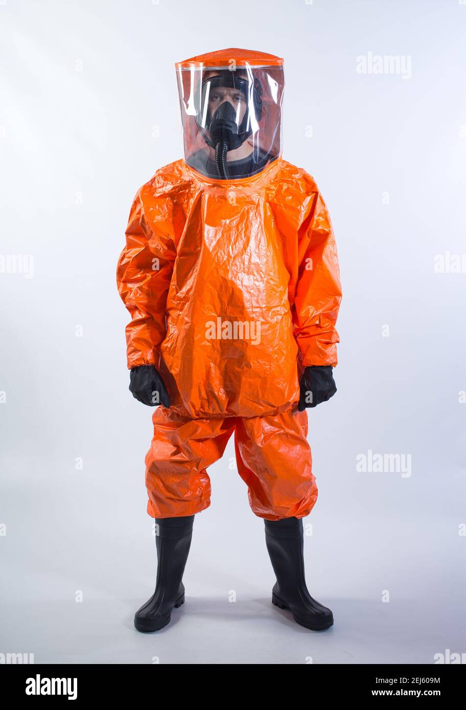 GERMANY / Frankfurt Main /Disinfecting personnel wearing protective suits and mask as a preventive measure against hazzard. Stock Photo