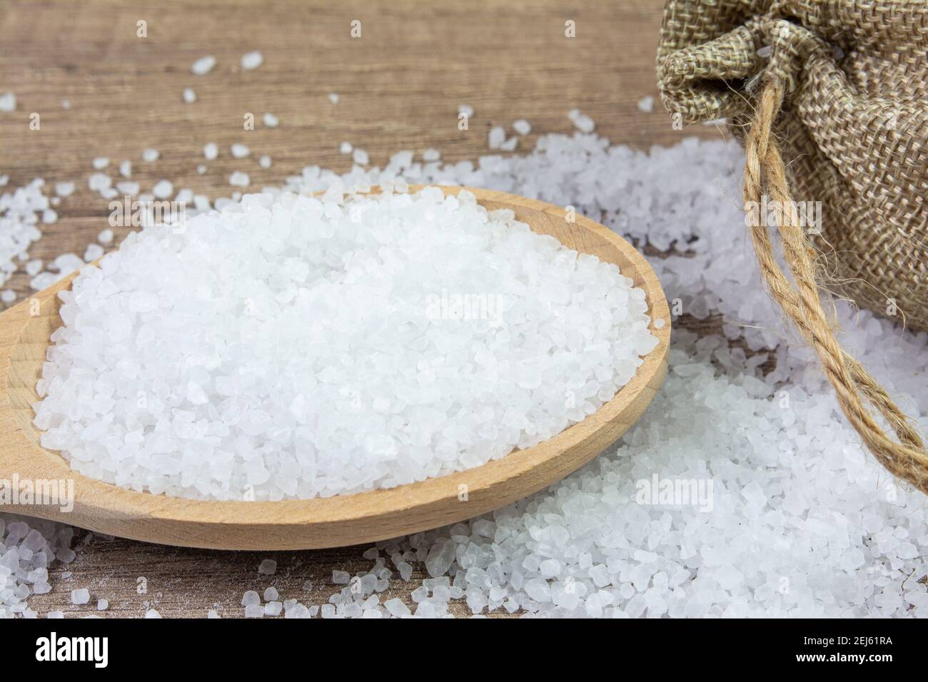 Coarse salt in a spoon Stock Photo Alamy