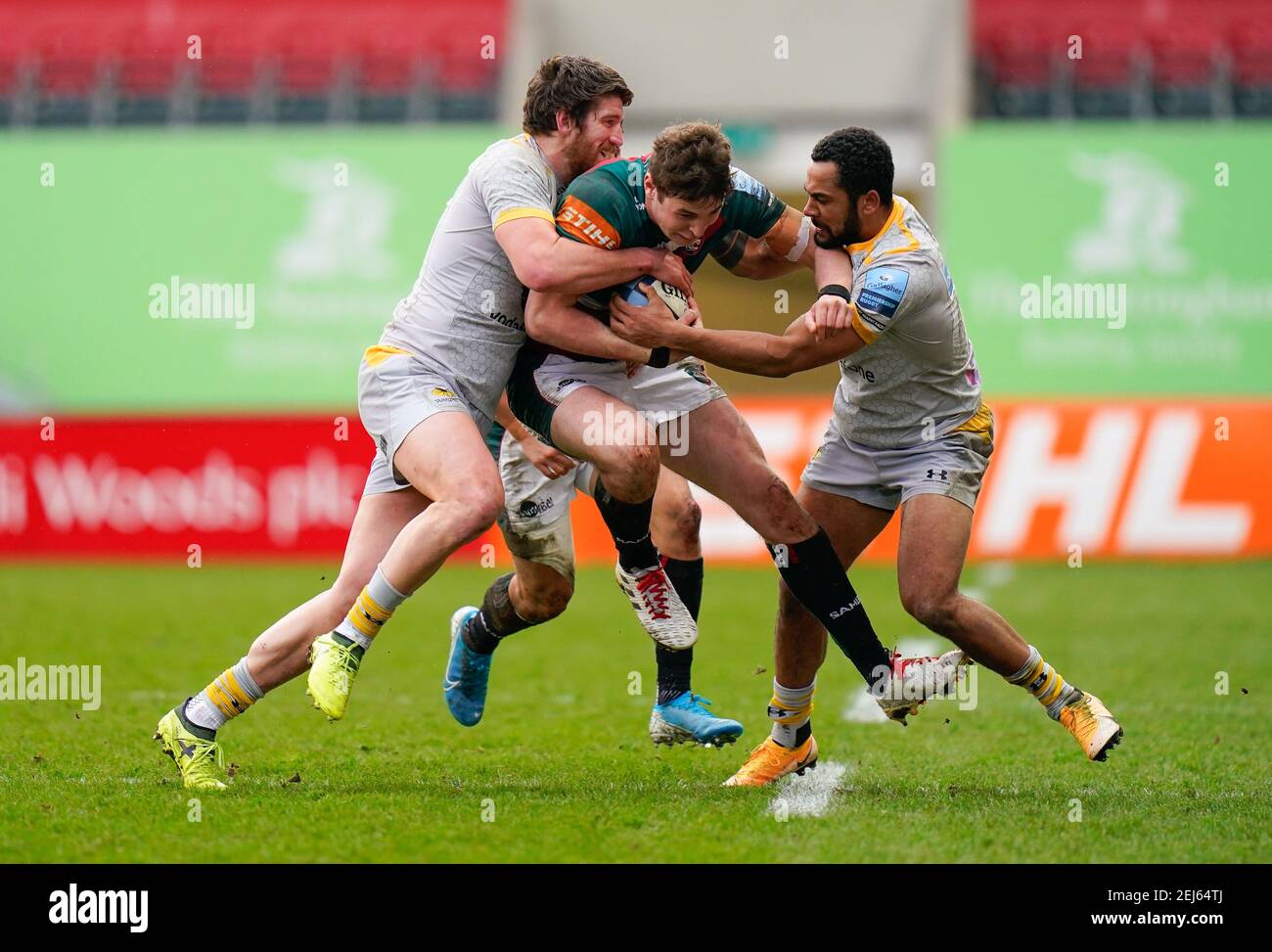 Wasps Centre Michaël Le Bourgeois and Winger Zach Kibirige combine to tackle Leicester Tigers full-back Freddie Steward during a Gallagher Premiership Stock Photo