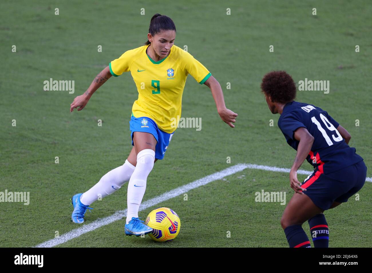 Orlando, Florida, USA . February 21, 2021: Brazil forward DEBINHA (9) competes for the ball against United States defender CRYSTAL DUNN (19) during the SheBelieves Cup United States vs Brazil match at Exploria Stadium in Orlando, Fl on February 21, 2021. Credit: Cory Knowlton/ZUMA Wire/Alamy Live News Stock Photo