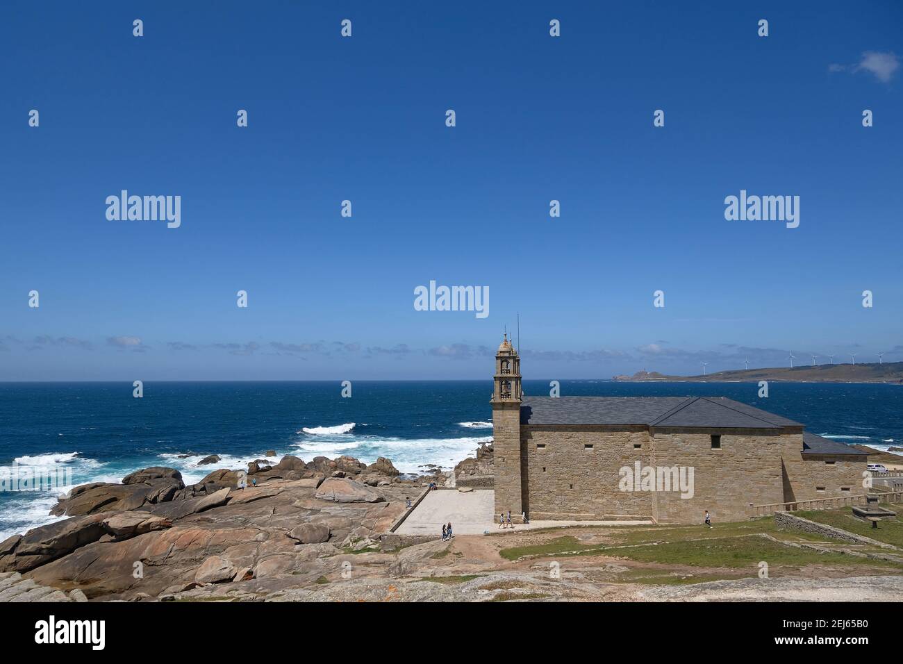 Wide view of Lady of Barca sanctuary church on Muxia Galicia sea coast,camino de Santiago landmarks Stock Photo