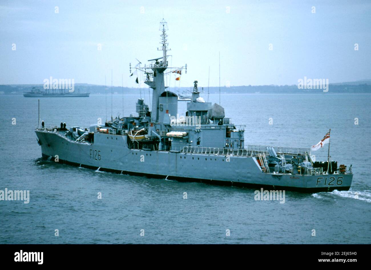 AJAXNETPHOTO. 1976. PORTSMOUTH, ENGLAND - FRIGATE HMS PLYMOUTH DEPARTS NAVAL BASE. ROTHESAY CLASS FRIGATE BUILT AT DEVONPORT DOCKYARD 1959. IN 1982, PLYMOUTH WAS ONE OF FIRST BRITISH WARSHIPS TO ARRIVE IN SOUTH ATLANTIC DURING THE FALKLANDS ISLANDS CONFLICT, TAKING PART IN RECAPTURE OF SOUTH GEORGIA DURING OPERATION PARAQUET.  PHOTO:JONATHAN EASTLAND/AJAX REF:602659 Stock Photo
