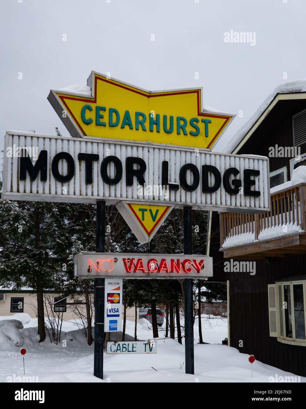 A sign for the Cedarhurst Motor Lodge in Speculator, NY USA in the Adirondack Mountains in winter Stock Photo