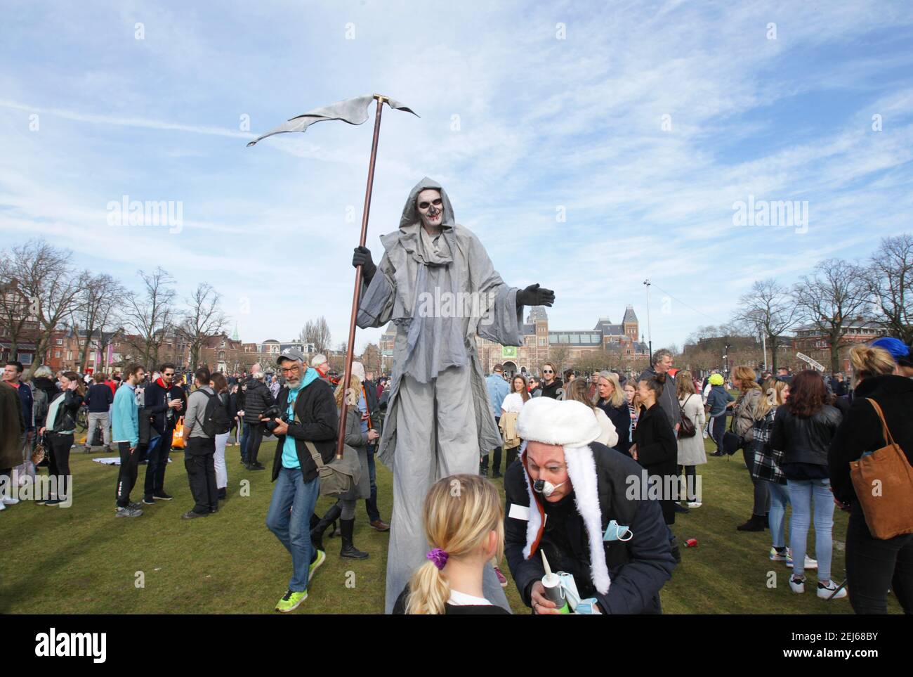 Anti-lockdown protester dressed as the grim reaper during an illegal demonstration against coronavirus measures at the Muaeumplein on February 21, 2 Stock Photo
