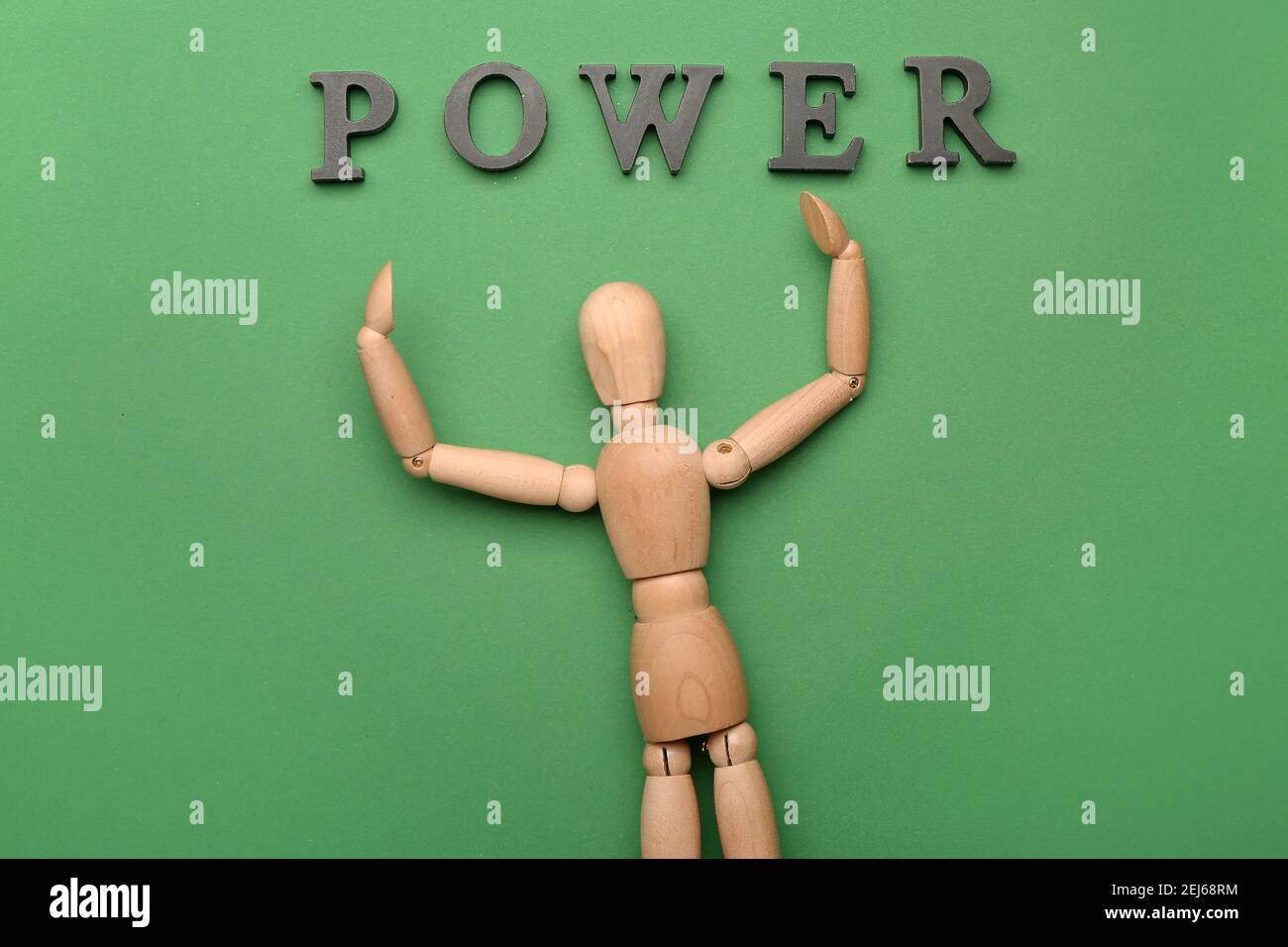 Wooden mannequin with word POWER on color background Stock Photo Alamy