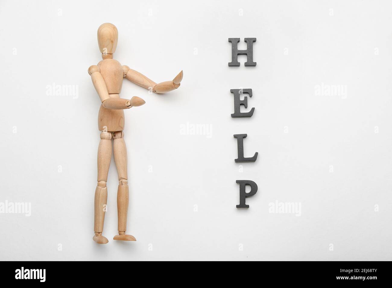 Wooden mannequin with word HELP on white background Stock Photo Alamy