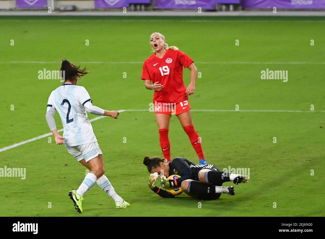 Orlando, United States. 21st Feb, 2021. Goalkeeper Laurina Oliveros (#12 Argentina) makes a save against Adriana Leon (#19 Canada) during the SheBelieves Cup International Womens match between Argentina and Canada at Exploria Stadium in Orlando, Florida. Credit: SPP Sport Press Photo. /Alamy Live News Stock Photo