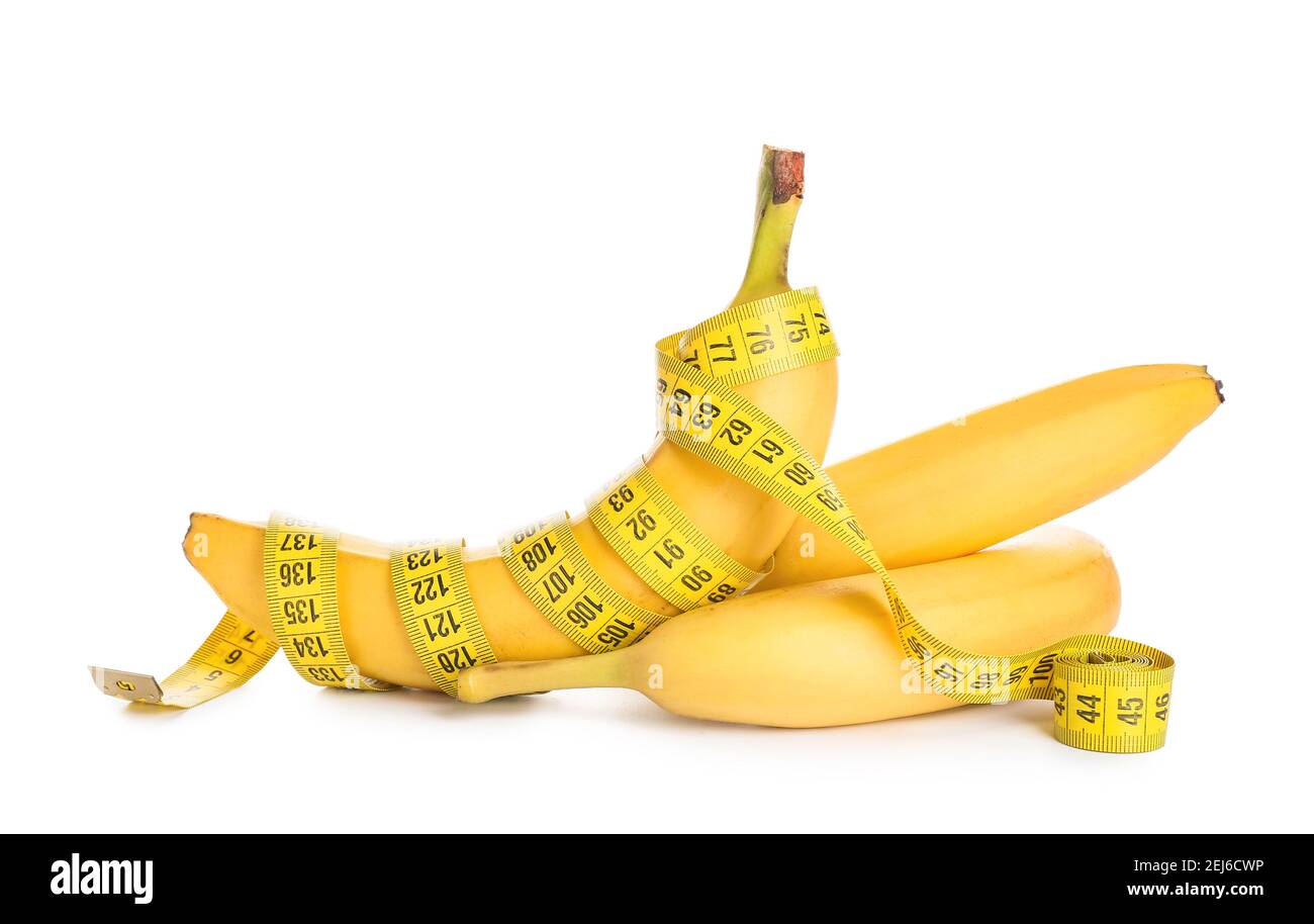 Ripe bananas and measuring tape on white background. Weight loss