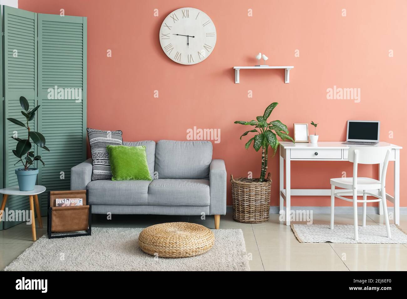 Interior of modern living room with sofa and table Stock Photo - Alamy