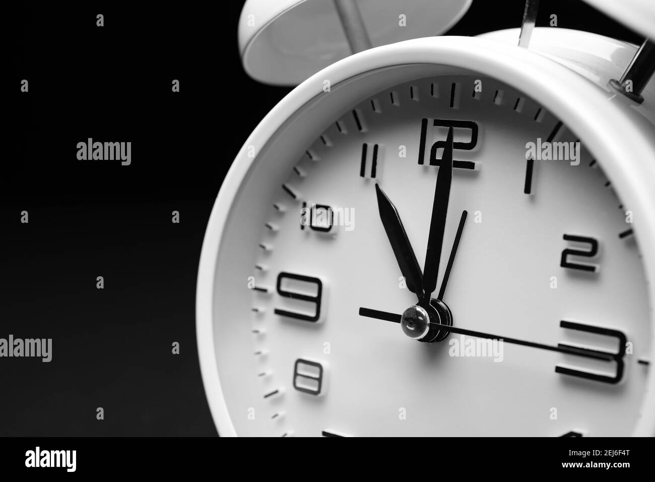 Alarm clock on black background, closeup Stock Photo - Alamy