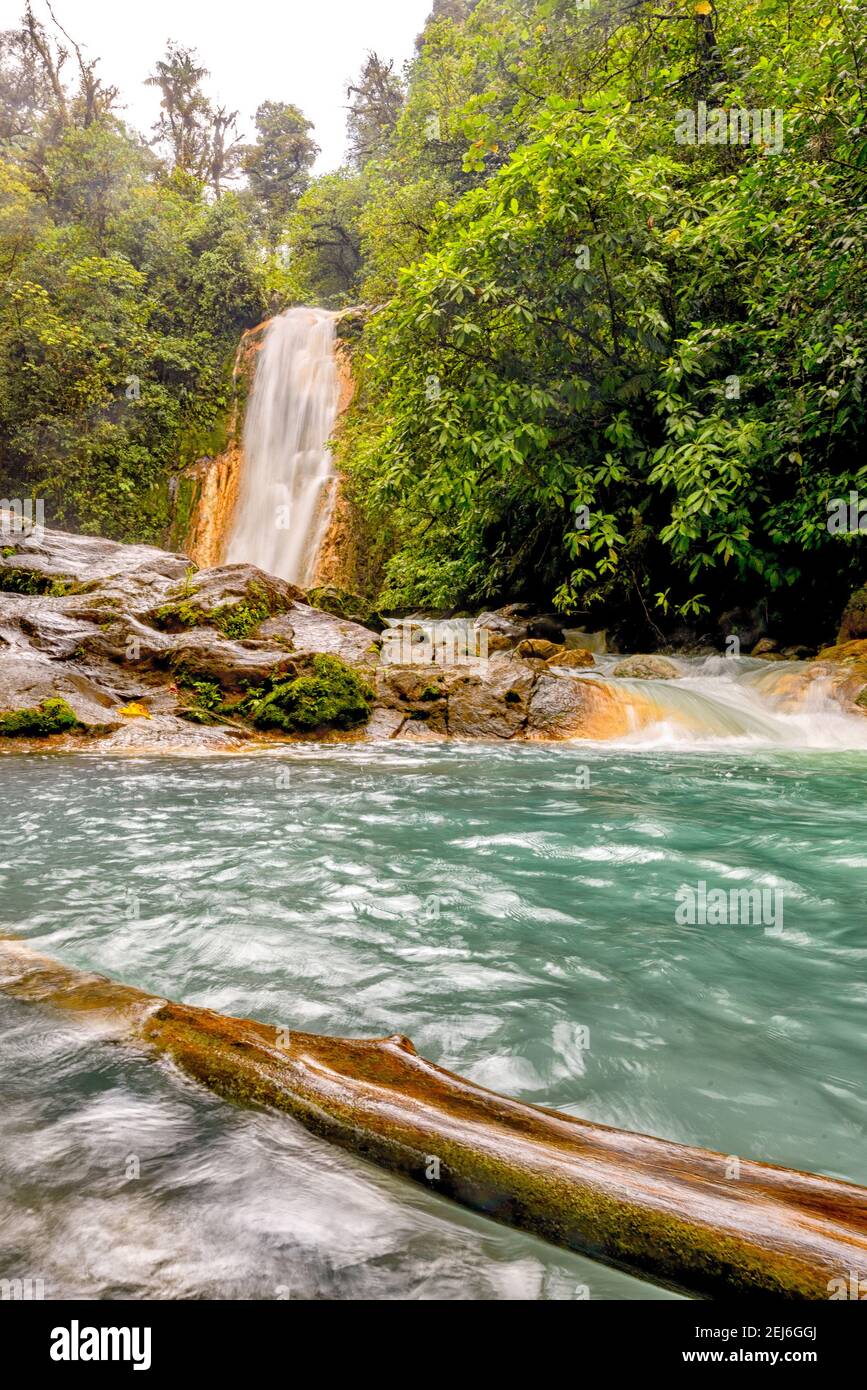Blue water flowing through Gemelas waterfalls in Bajos del Toro, Costa Rica Stock Photo