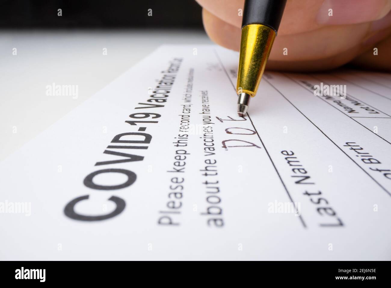 Close-up view of issuing Covid-19 vaccination record card Stock Photo
