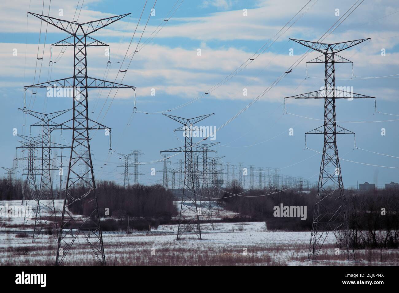 Giant electricity transmission towers snaking off into the distance
