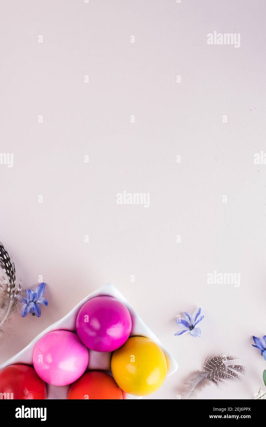 Colorful Easter eggs on a pink background. Bright Easter concept. Copy space. Stock Photo