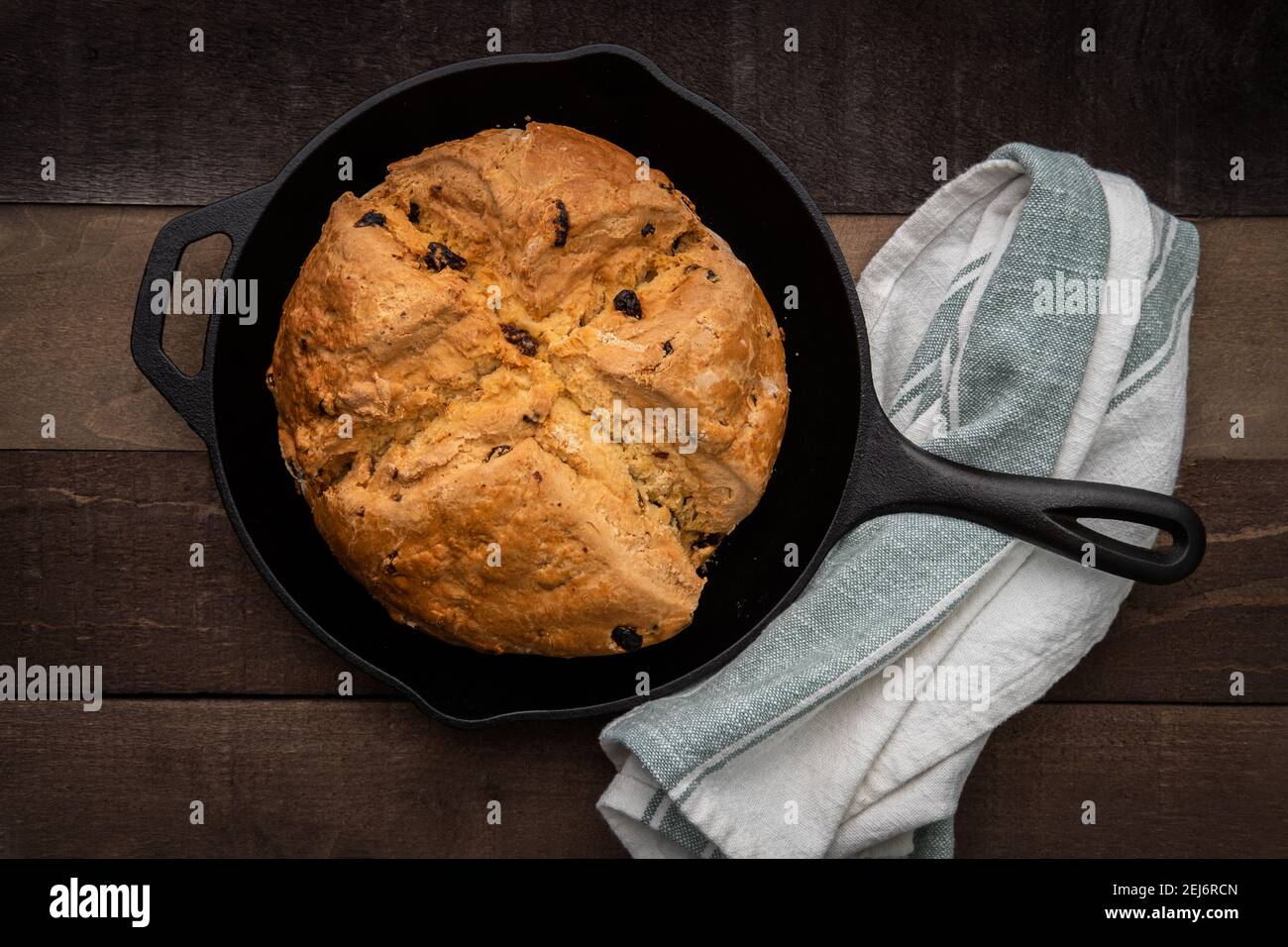 Photograph of Irish Soda Bread baked in a cast iron skillet Stock Photo