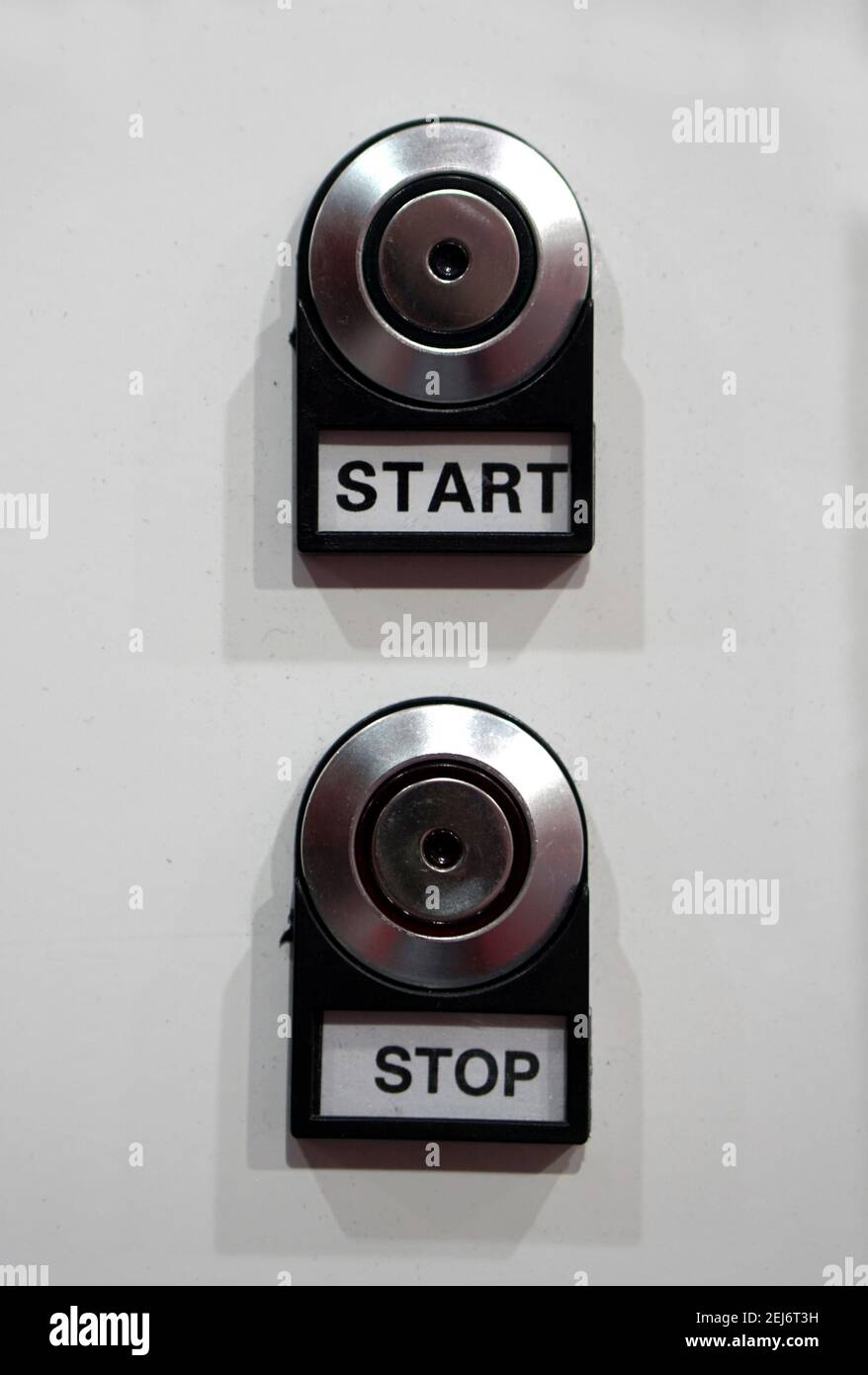 Close-up view of Start and Stop knob on a control panel in an industry Stock Photo