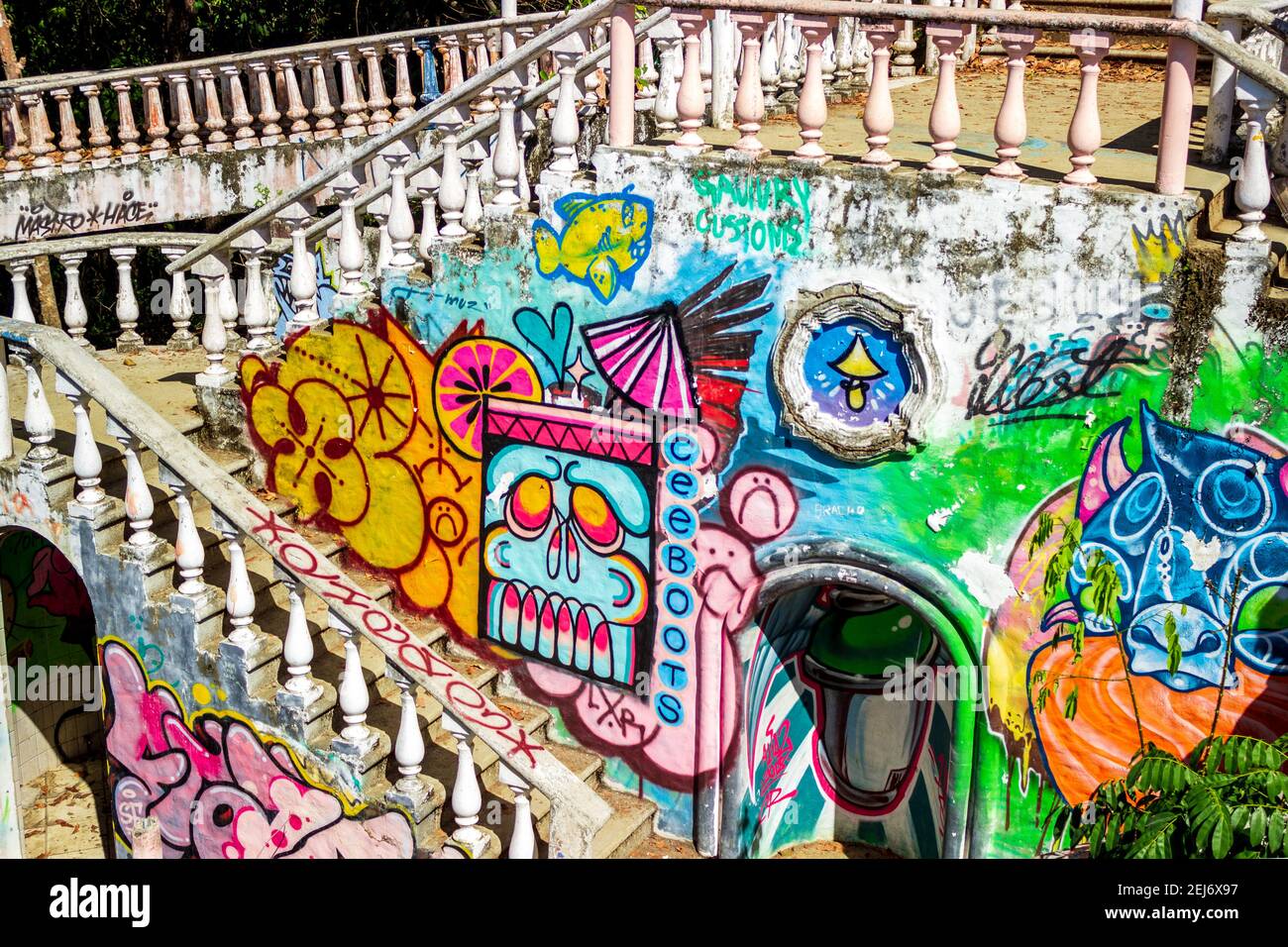 The ruins of a rumored resort, hotel or house provide a canvas for artistic graffiti handiwork in the jungle near Jaco, Costa Rica. Stock Photo