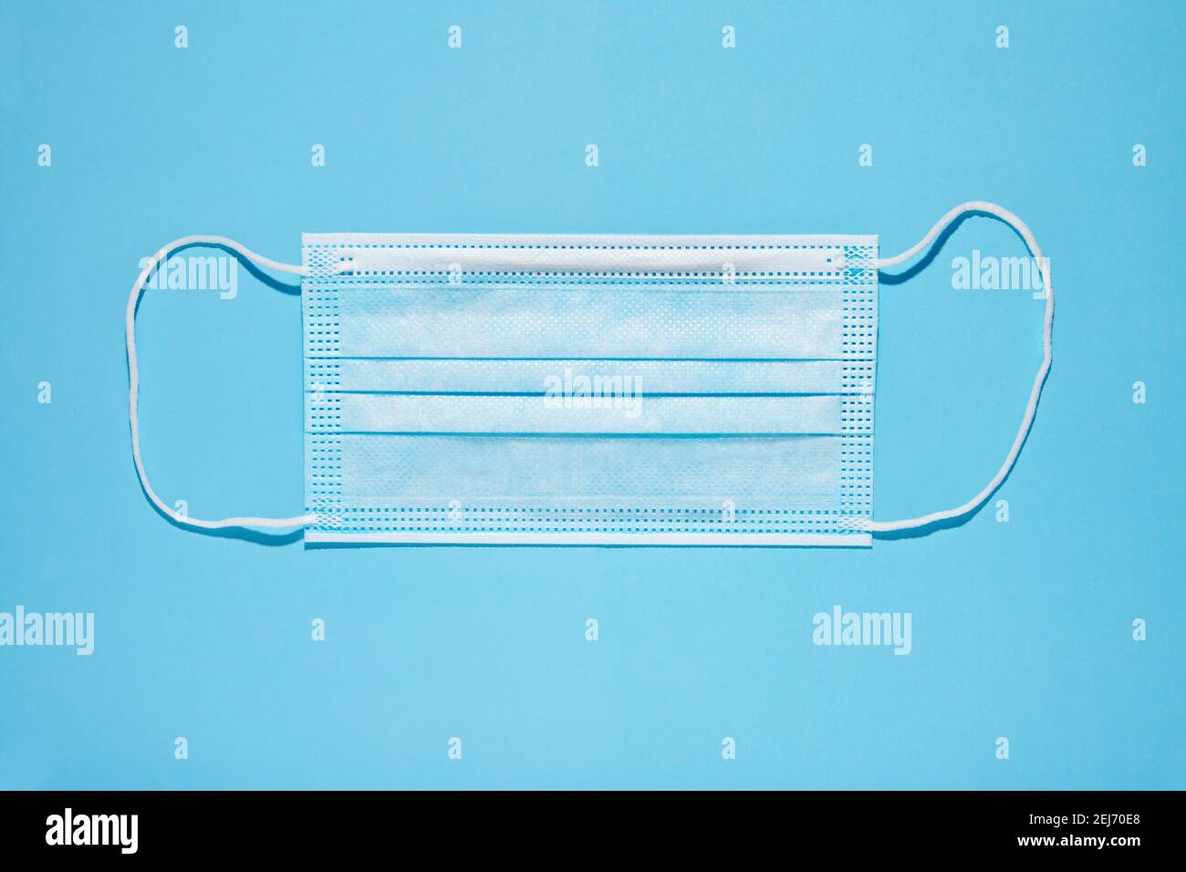 Top view of clean disposable face mask for medical use placed on blue background Stock Photo Alamy