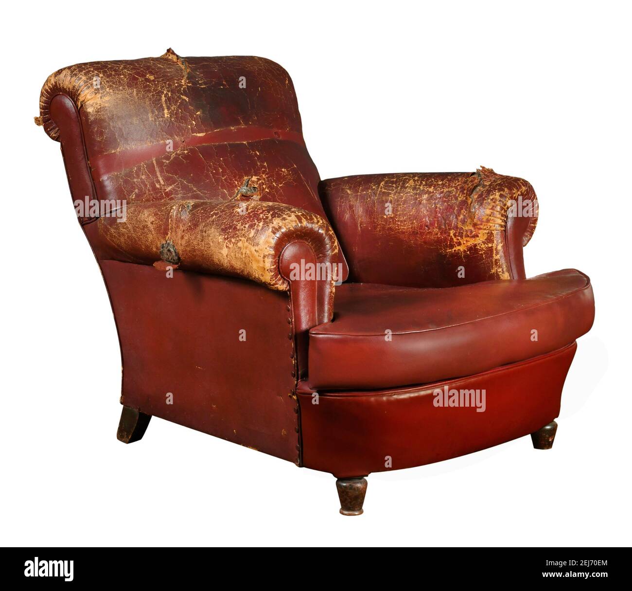 Aged red armchair with shabby leather armrests and back isolated on white background Stock Photo